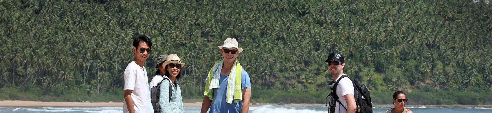 Tourists on a beach in North Nias (Nias Utara), Nias Island, Indonesia.