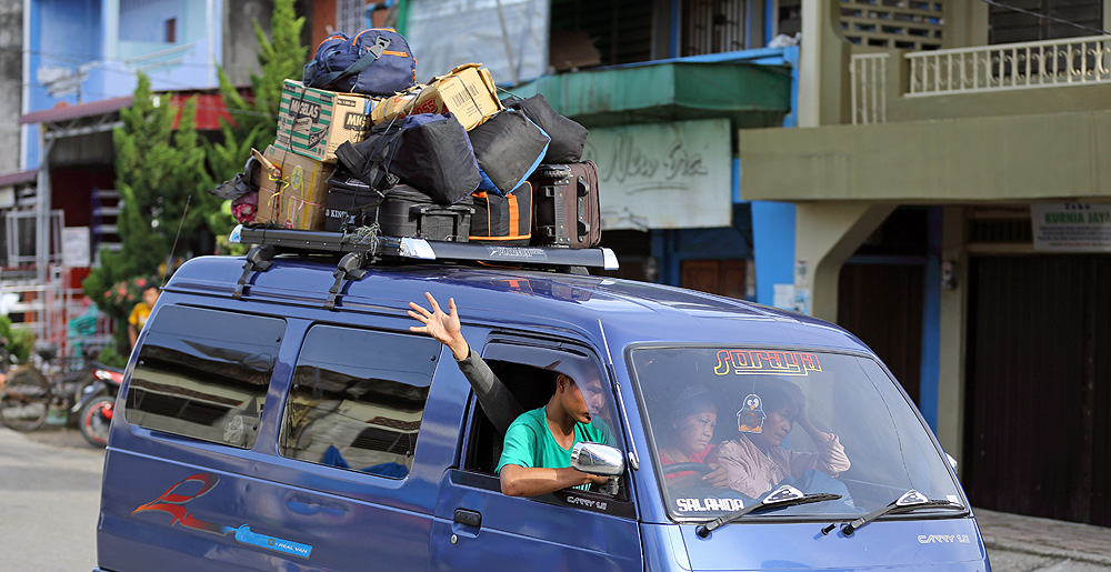 Angkot - (private minibus) taking passengers back and forth between towns and villages on Nias Island, Indonesia.