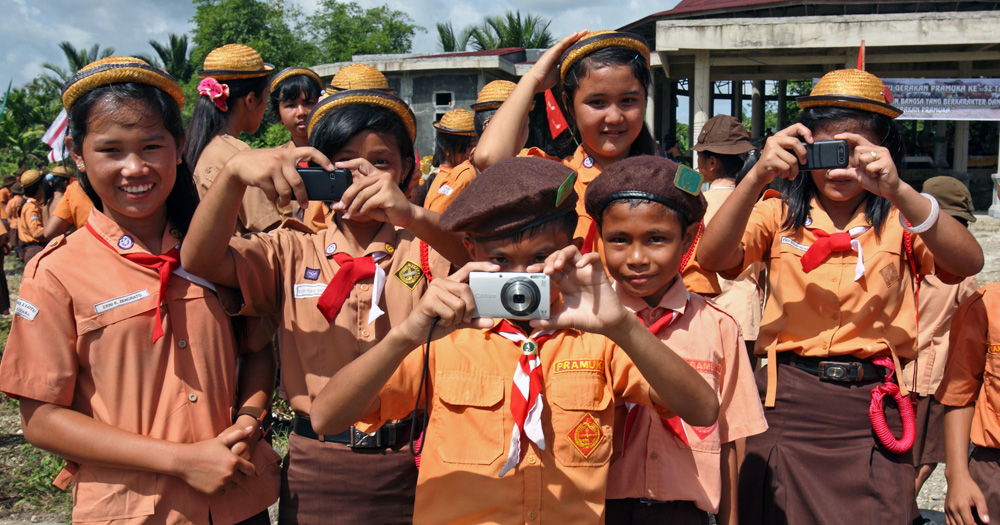 Scout kids taking photo of foreigner in North Nias, Indonesia.