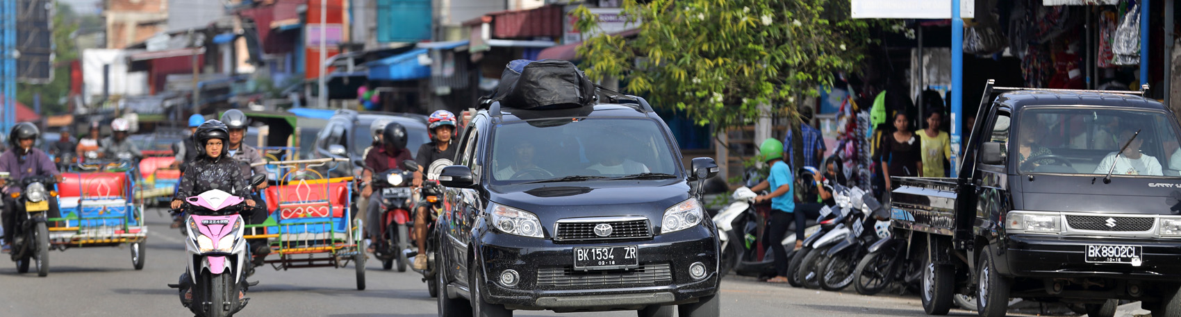 Private taxi taking surfers from the airport to various surf locations on Nias Island, Indonesia.