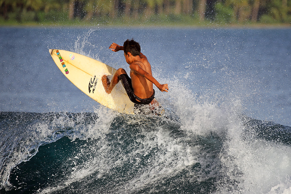 Local kids playing around at Kiddies Corner. Sorake, Lagundri Bay. Photo by Bjorn Svensson.