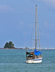 Sailing boat in Lagundri Bay, near the famous wave in Sorake.