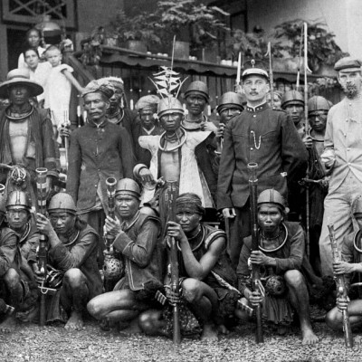 A band of Nias headhunters in a meeting with the Dutch. Tropenmuseum Collection.