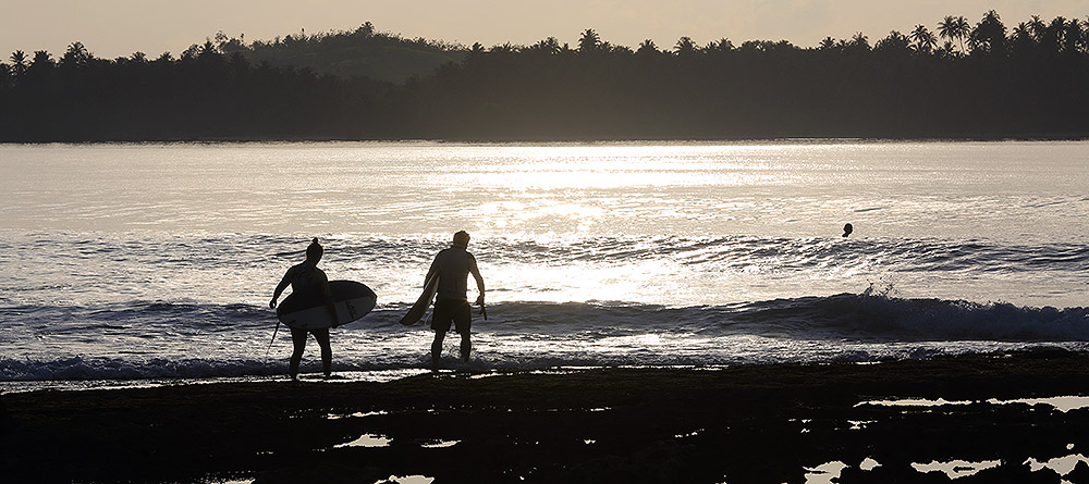 Early morning surf at "The Point" in front of Sorake in Lagundri Bay.