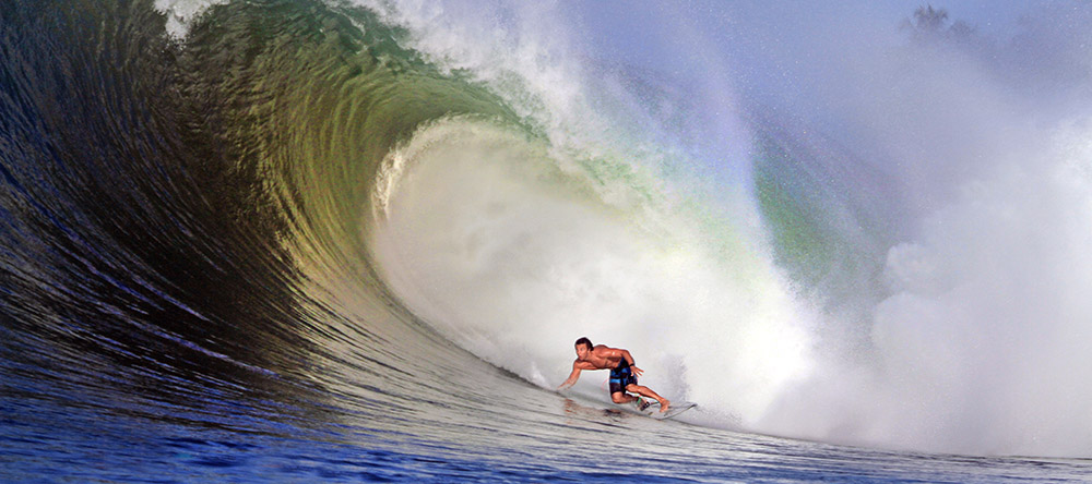 Surfing the Point at Sorake, Lagundri Bay. Photo by Nias surf photographer Justin Bu'ulölö.