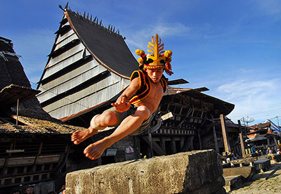 Stone jumping in front of the chiefs house.